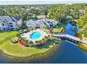 Community pool and lakefront views at 940 Village Trail # 7-107, Port Orange, FL 32127