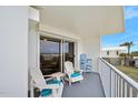 Relaxing balcony with ocean views, furnished with Adirondack chairs at 1183 Ocean Shore Blvd # 1040, Ormond Beach, FL 32176