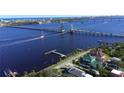 Sailboat passing under the bridge in an aerial view at 546 Rio Vista Ave, Daytona Beach, FL 32114