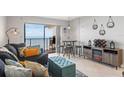 Living room with ocean view, comfy seating, and dining table at 2700 Ocean Shore Blvd # 508, Ormond Beach, FL 32176