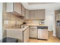 Granite countertop kitchen with stainless steel appliances at 1 Oceans West Blvd # 5B3, Daytona Beach, FL 32118