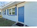 Newly painted light blue house with a blue front door at 1448 Richmond Ave, Daytona Beach, FL 32117