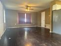 Dark wood floors and neutral-colored walls at 1215 E Hazzard Ave, Eustis, FL 32726