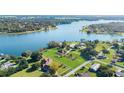 Aerial view showcasing lakefront homes and community landscape at 380 Lakeshore Ave, Umatilla, FL 32784