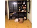 Living room with antique display cabinet at 912 Holiday Ln, Leesburg, FL 34748