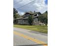 Two story home with shingle siding and mature landscaping at 5708 Se 109Th St, Belleview, FL 34420