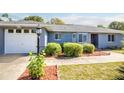 House exterior, driveway, and landscaping at 40544 E 7Th Ave, Umatilla, FL 32784