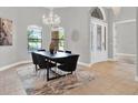Formal dining room with a black table and modern black chairs at 5418 Meadow Hill Loop, Lady Lake, FL 32159