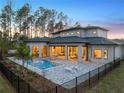 Luxury home with a large pool, patio, and outdoor living space at 16340 Pendio Dr, Bella Collina, FL 34756