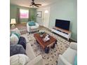 Living room with comfy seating and a rustic coffee table at 1501 N Cr 19A, Eustis, FL 32726