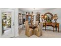 Elegant dining room with ornate furniture and natural light at 122 Baytree Blvd, Tavares, FL 32778