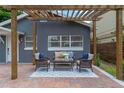 Relaxing patio with pergola and comfortable seating at 1921 Dartmouth Ave, Winter Park, FL 32789