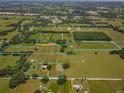 Aerial view of a large land with multiple parcels and surrounding landscape at 2198 Se 110Th Ave, Webster, FL 33597