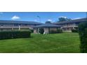 Neatly landscaped yard with lush greenery and well-maintained lawn at 1100 E Caroline St # 115, Tavares, FL 32778