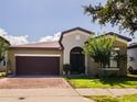 Beautiful two-story home with two-car garage and well-manicured lawn at 9342 Oglethorpe Dr, Groveland, FL 34736