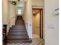 Elegant entryway with a grand staircase and private elevator at 33 Camino Real # 303, Howey In The Hills, FL 34737