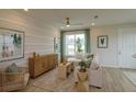 Light and airy living room with beige sofa at 16388 Hamlin Hills Rd, Winter Garden, FL 34787