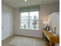 Bright entryway with tile floors and console table at 16388 Hamlin View St, Winter Garden, FL 34787