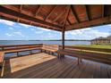 Lakefront gazebo with wooden benches offering scenic views at 1261 W Lakeshore Dr, Clermont, FL 34711