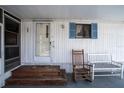 Porch with rocking chairs and wooden steps at 1306 Westland Dr, Tavares, FL 32778