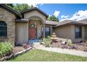 Attractive entryway with fountain and landscaping at 3011 Indian Trl, Eustis, FL 32726