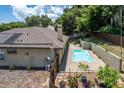 Inviting kidney-shaped pool with surrounding patio at 3011 Indian Trl, Eustis, FL 32726