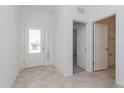 Bright entryway with tile flooring and access to bathroom at 1578 Outback Rd, Saint Cloud, FL 34771