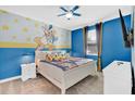Charming bedroom with a Donald Duck theme at 4189 Paragraph Dr, Kissimmee, FL 34746