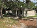 A small house with a yard at 1605 Rose Ln, Eustis, FL 32726