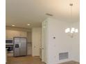 Modern kitchen with stainless steel appliances and ample cabinet space at 2368 Juniper Berry Dr, Minneola, FL 34715