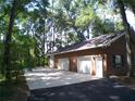 Attached three-car brick garage with ample parking space at 415 Se 123Rd Street Rd, Ocala, FL 34480