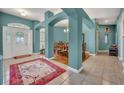 Elegant entryway with high ceilings and tile floors at 3914 Scarborough Ct, Clermont, FL 34711