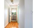Light and airy entryway with wood flooring and access to screened porch at 601 N Mcdonald St # 608, Mount Dora, FL 32757