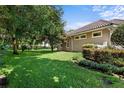 Spacious backyard with a large grassy area and privacy fence at 8692 Crested Eagle Pl, Sanford, FL 32771
