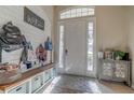 Bright and spacious entryway with built-in bench and storage at 32313 Oak Canopy Dr, Sorrento, FL 32776