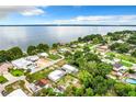 Aerial view of waterfront community with numerous houses at 34035 Linda Ln, Leesburg, FL 34788