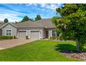 Front view of home with two-car garage at 3603 Solana Cir # B, Clermont, FL 34711