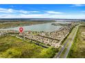 Aerial view of the home's location by the lake at 1103 White Water Bay Dr, Groveland, FL 34736