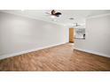 Bright and airy living room featuring wood-look tile flooring at 1391 Cedar Ave, Tavares, FL 32778