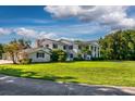 Spacious home exterior with large yard at 6779 Clayton St, Mount Dora, FL 32757