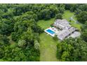 Aerial view of home and pool at 6779 Clayton St, Mount Dora, FL 32757