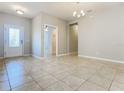 Bright and airy living room with tile flooring and neutral walls at 17106 Gathering Place Cir, Clermont, FL 34711