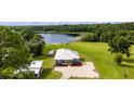 Lakefront home with large yard and shed at 4114 Dove Valley Ln, Lady Lake, FL 32159