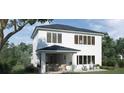 Two-story home with covered patio, large windows and backyard at 576 Casey Loop, Mount Dora, FL 32757