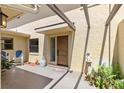 Courtyard entry with door and blue chairs at 1111 Lakeshore Dr # A3, Eustis, FL 32726