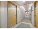 Building hallway with carpeted floors and neutral walls at 155 S Court Ave # 1507, Orlando, FL 32801