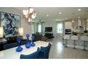 Modern kitchen with stainless steel appliances and an island at 5143 Firebush Dr, Apopka, FL 32712