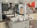 Spacious kitchen with island, stainless steel appliances, and modern cabinetry at 1304 Ocoee Apopka Rd, Ocoee, FL 34761