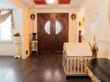 Grand entryway with double doors and hardwood floors at 1304 Ocoee Apopka Rd, Ocoee, FL 34761