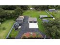 Aerial view showing a house, detached garage, and large backyard at 1817 Demastus Ln, Ocoee, FL 34761